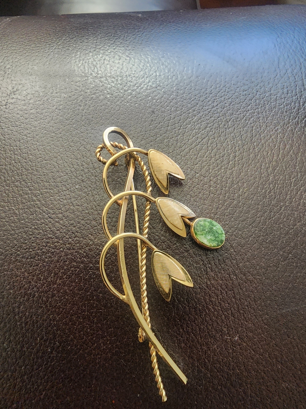 Gold-Tone Floral Brooch with Green Stone Accent